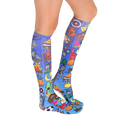 Lifestyle shot of Galaxy Camp socks on a person's legs, showcasing the socks' design and fit. [lf]