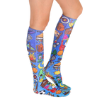 Lifestyle shot of Galaxy Camp socks on a person's legs, showcasing the socks' design and fit. [lf]