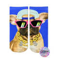 Crew socks featuring a French bulldog wearing pink sunglasses, a baseball cap, and a gold chain. The background is bright blue. Glitter edition. [lf]