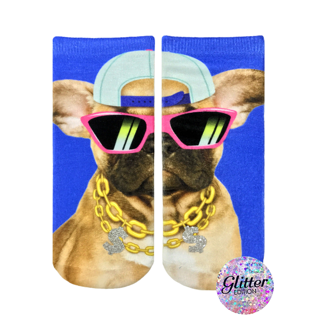 Crew socks featuring a French bulldog wearing pink sunglasses, a baseball cap, and a gold chain. The background is bright blue. Glitter edition. [lf]