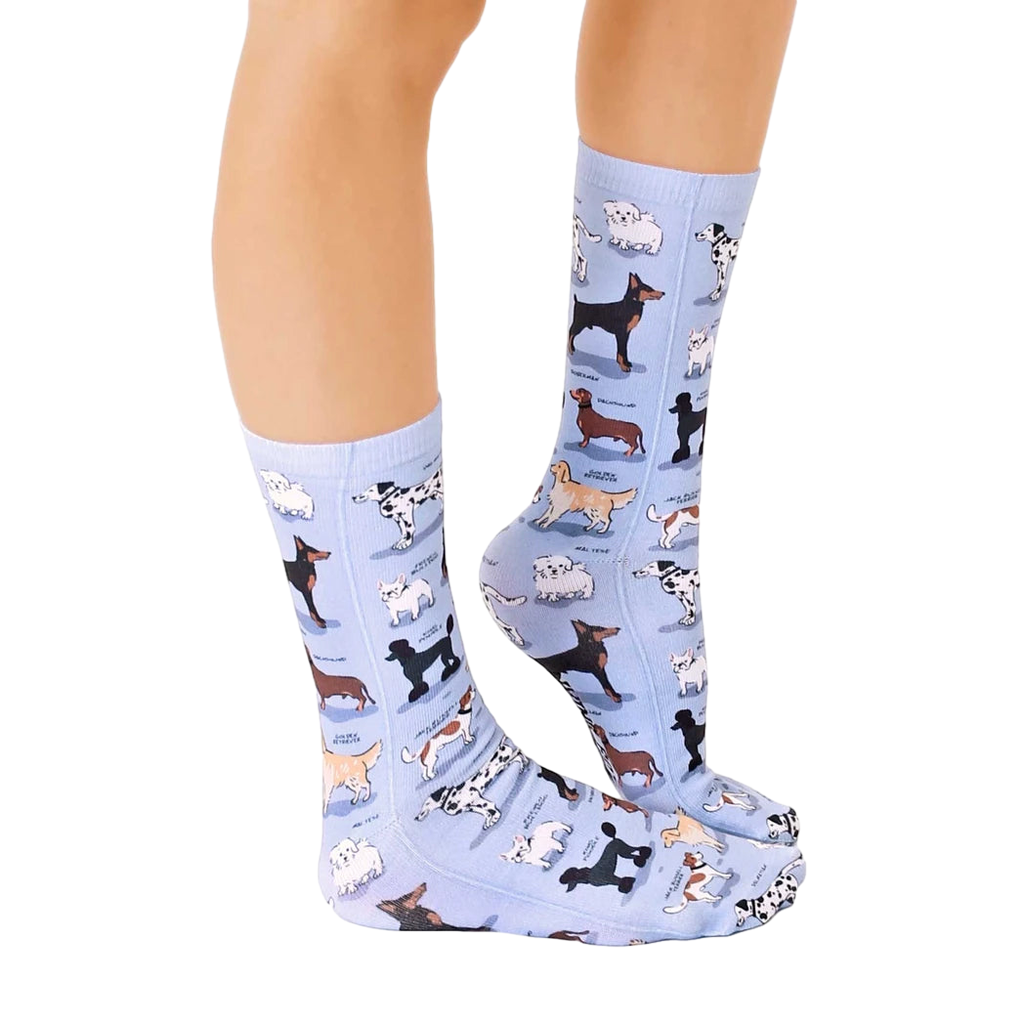 Lifestyle shot of a person wearing the Dog Breeds socks, showing how they look when worn. [lf]