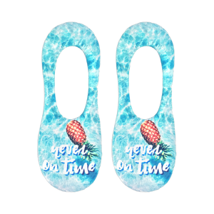 Pair of light blue no-show socks.  Features a pineapple and 'Never On Time' text on a water-like background.