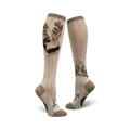A pair of beige knee-high socks with a whimsical barn owl design. One sock shows a single owl in flight; the other shows two owls perched on a branch.