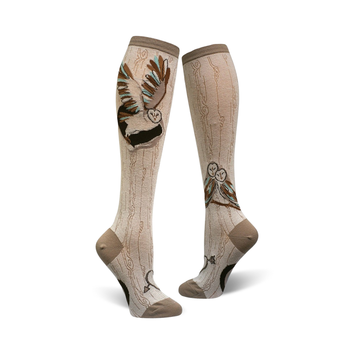 A pair of beige knee-high socks with a whimsical barn owl design. One sock shows a single owl in flight; the other shows two owls perched on a branch.