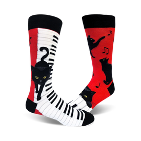 black, red, and white crew socks feature a pattern of cats playing pianos.   