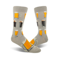 Pair of grey crew socks with illustrations of beer steins and glasses in orange, yellow, and brown.