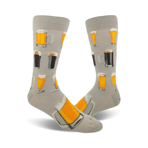 Pair of grey crew socks with illustrations of beer steins and glasses in orange, yellow, and brown.
