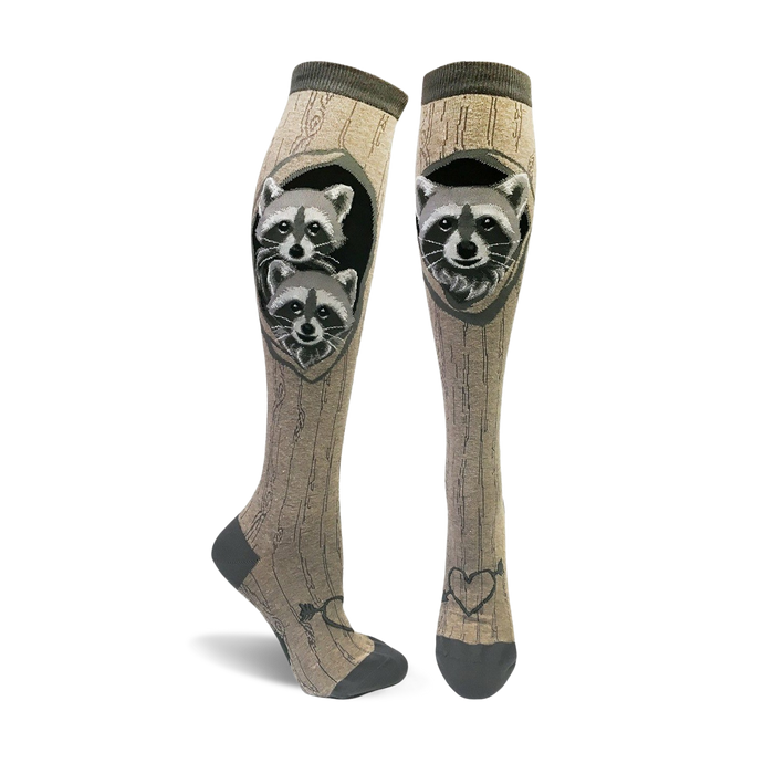 knee high raccoon socks for women featuring 2 raccoons peeking out of a hole in the wood grain pattern.   }}
