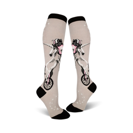 gray knee high women's socks with unicycling unicorn pattern in pink and black.  