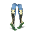 A pair of women's knee-high socks. Light blue background with a llama design, green bottom, and small daisy accents.