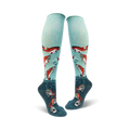Pair of teal knee-high socks adorned with leaping orange salmon and teal waves.  A fun and unique design!