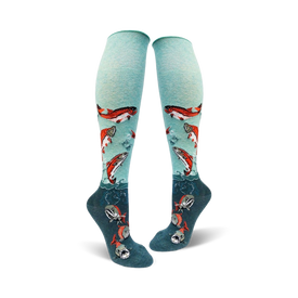 mint green and dark teal knee high socks for women with a pattern of sockeye salmon swimming up from the teal to the mint green part of the sock.   