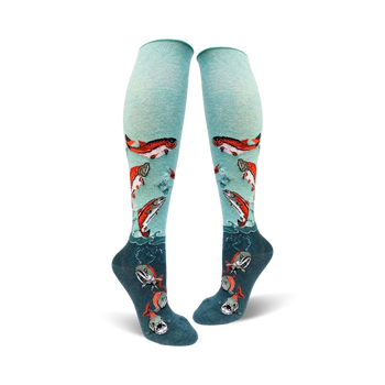 mint green and dark teal knee high socks for women with a pattern of sockeye salmon swimming up from the teal to the mint green part of the sock.   