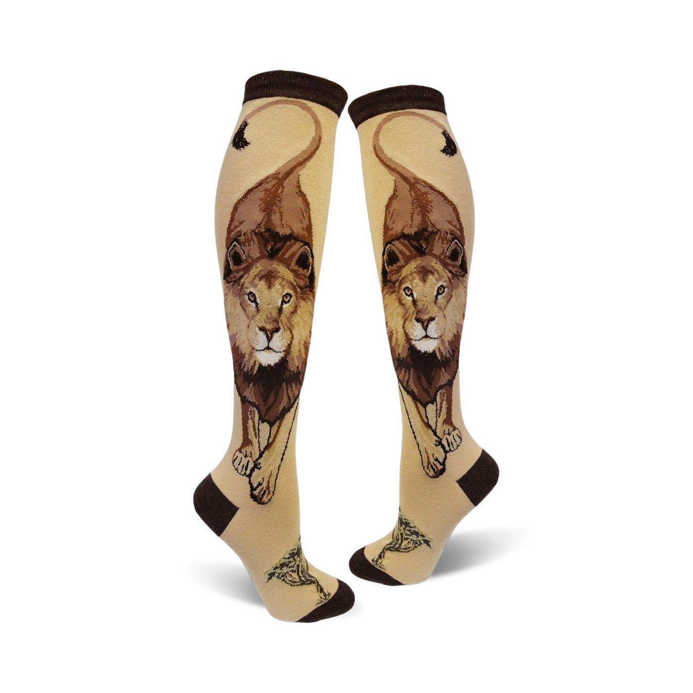 Pair of cream knee-high socks with a detailed brown lion design, including its mane and tail, and small tree accents at the bottom.