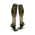 Pair of knee-high socks.  Olive green background with a detailed tiger design in orange, black, and white. Tiger is facing forward with its tail visible.