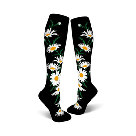 crazy for daisies knee high socks for women feature an all-over pattern of yellow and white daises with green stems and leaves on black.  