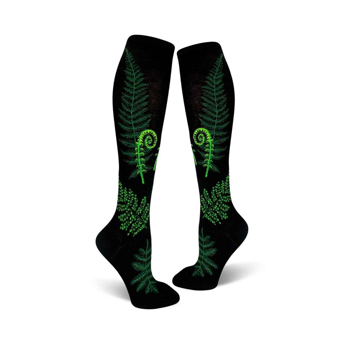 Pair of black knee-high socks featuring bright green ferns and fiddleheads. Botanical print on a black background.