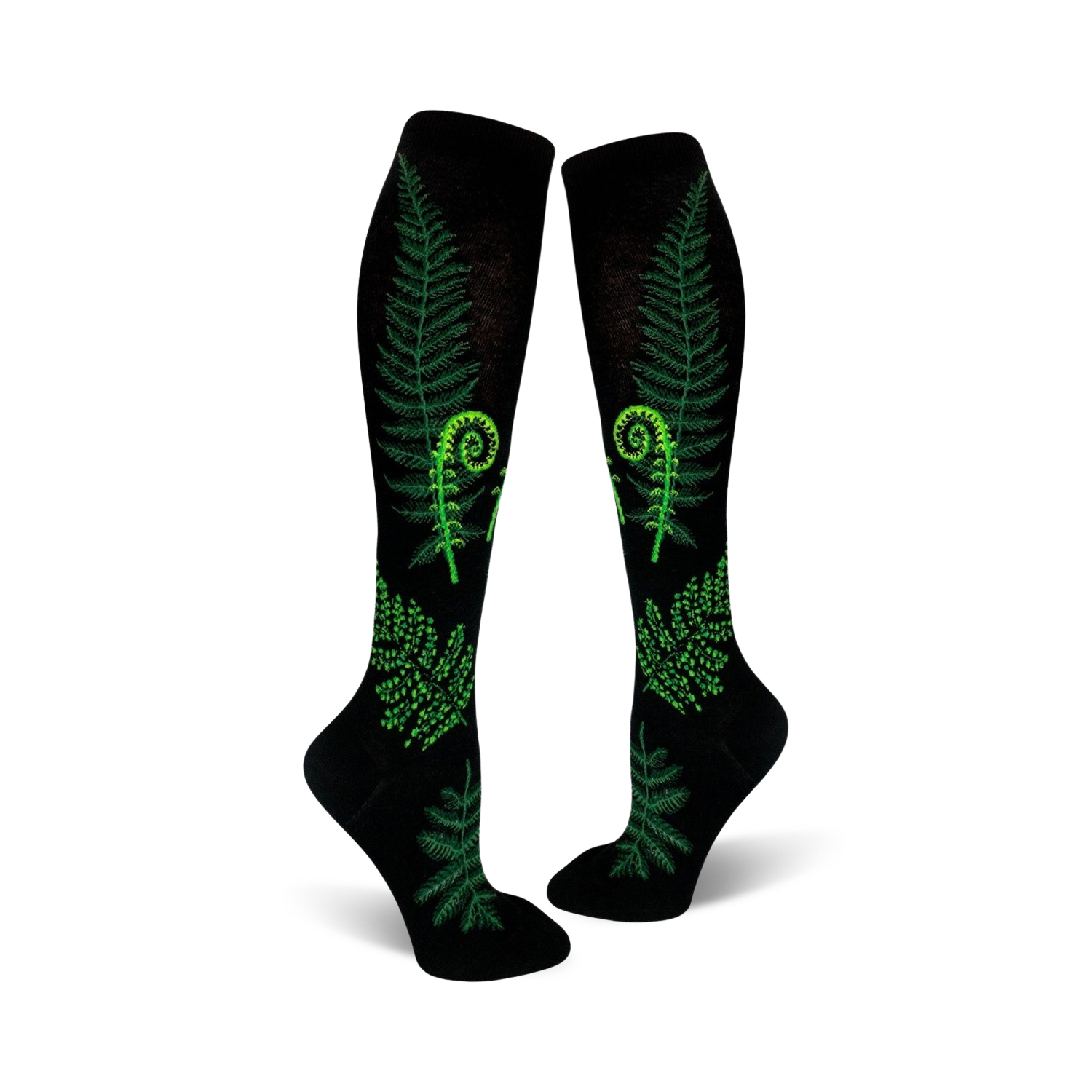 Pair of black knee-high socks featuring bright green ferns and fiddleheads. Botanical print on a black background.