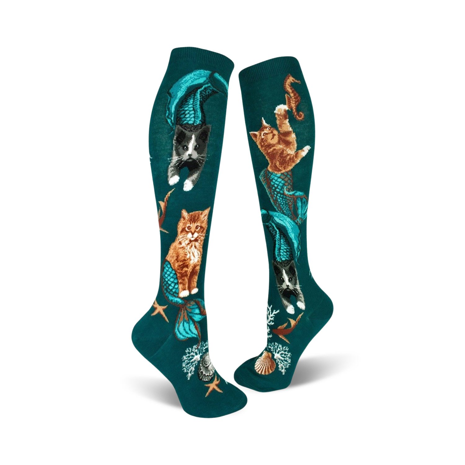 A pair of teal knee-high socks showcasing cats with mermaid tails.  Other designs include seahorses, starfish, and seashells.