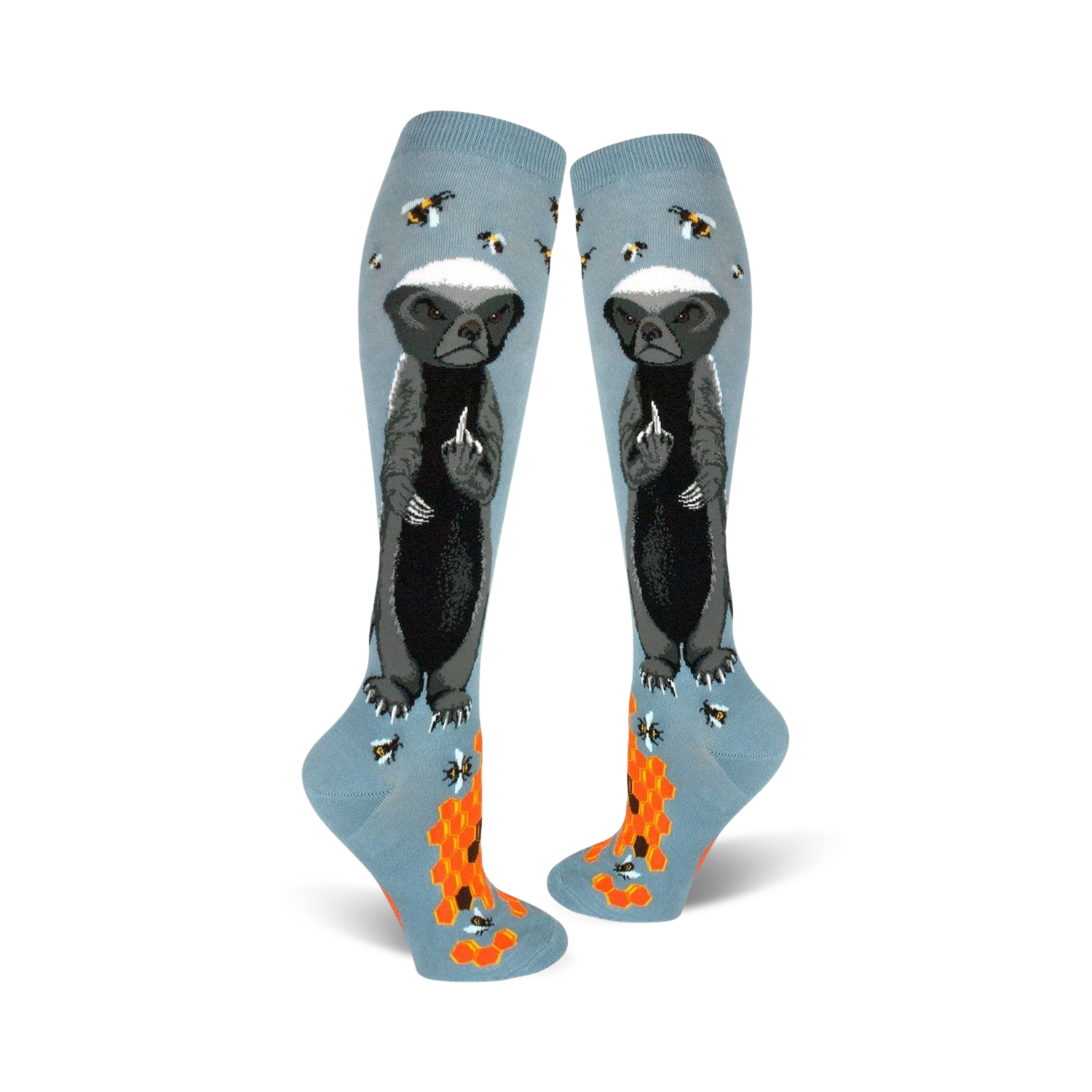 Pair of light blue knee-high socks with a honey badger giving the middle finger, bees, and honeycomb design.