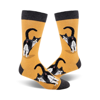 black and white tuxedo cat butt pattern on yellow crew socks for men. gray toe, heel, and cuff.   