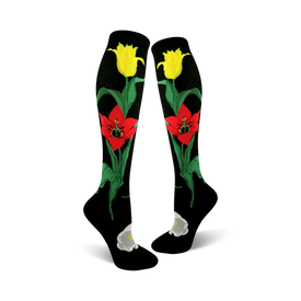 black knee-high womens socks feature a red and yellow tulip pattern along with green stems and leaves.  