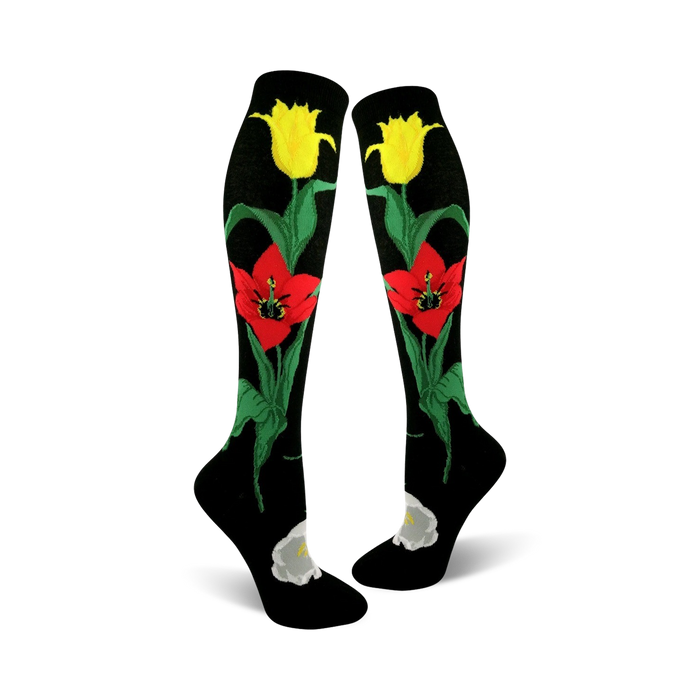black knee-high womens socks feature a red and yellow tulip pattern along with green stems and leaves.   }}
