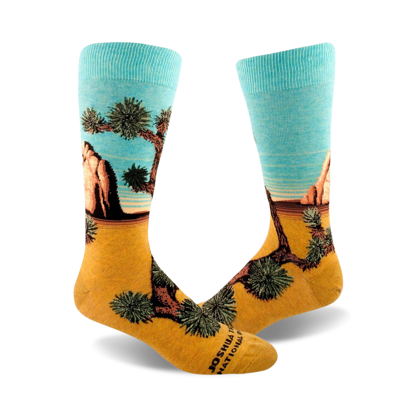 A pair of crew socks showcasing a Joshua Tree National Park landscape. The socks are teal and gold, depicting a desert scene with a prominent Joshua tree.