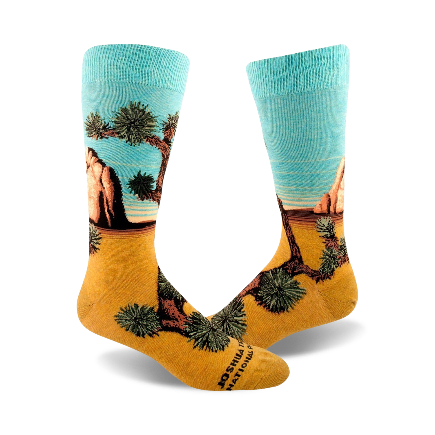 A pair of crew socks showcasing a Joshua Tree National Park landscape. The socks are teal and gold, depicting a desert scene with a prominent Joshua tree.