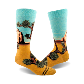mens crew socks with a joshua tree desert plant and rock pattern. colors are brown, green, and light blue.  