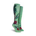 Lifestyle shot of a woman's legs wearing the beet socks outdoors.