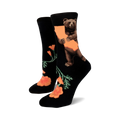 A pair of black crew socks with an illustration of a bear hugging the California outline and orange California poppies.