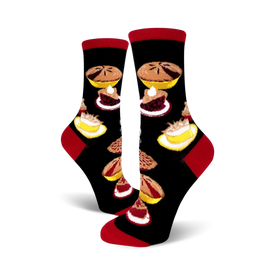 black crew socks with colorful pie patterns, featuring cherry, blueberry, and apple fillings. red toe and heel. women's size.  