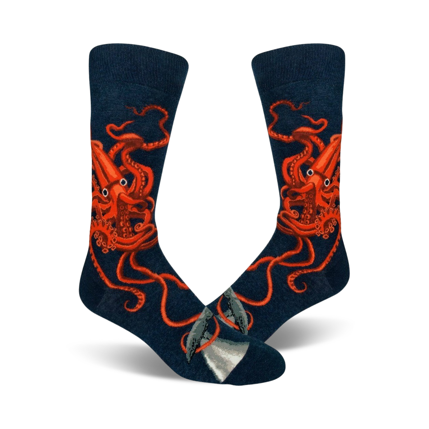 A pair of navy blue crew socks with a detailed illustration of a giant squid in bright orange.  A small whale is visible near the toes.