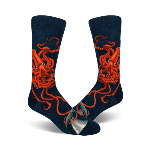 A pair of navy blue crew socks with a detailed illustration of a giant squid in bright orange.  A small whale is visible near the toes.