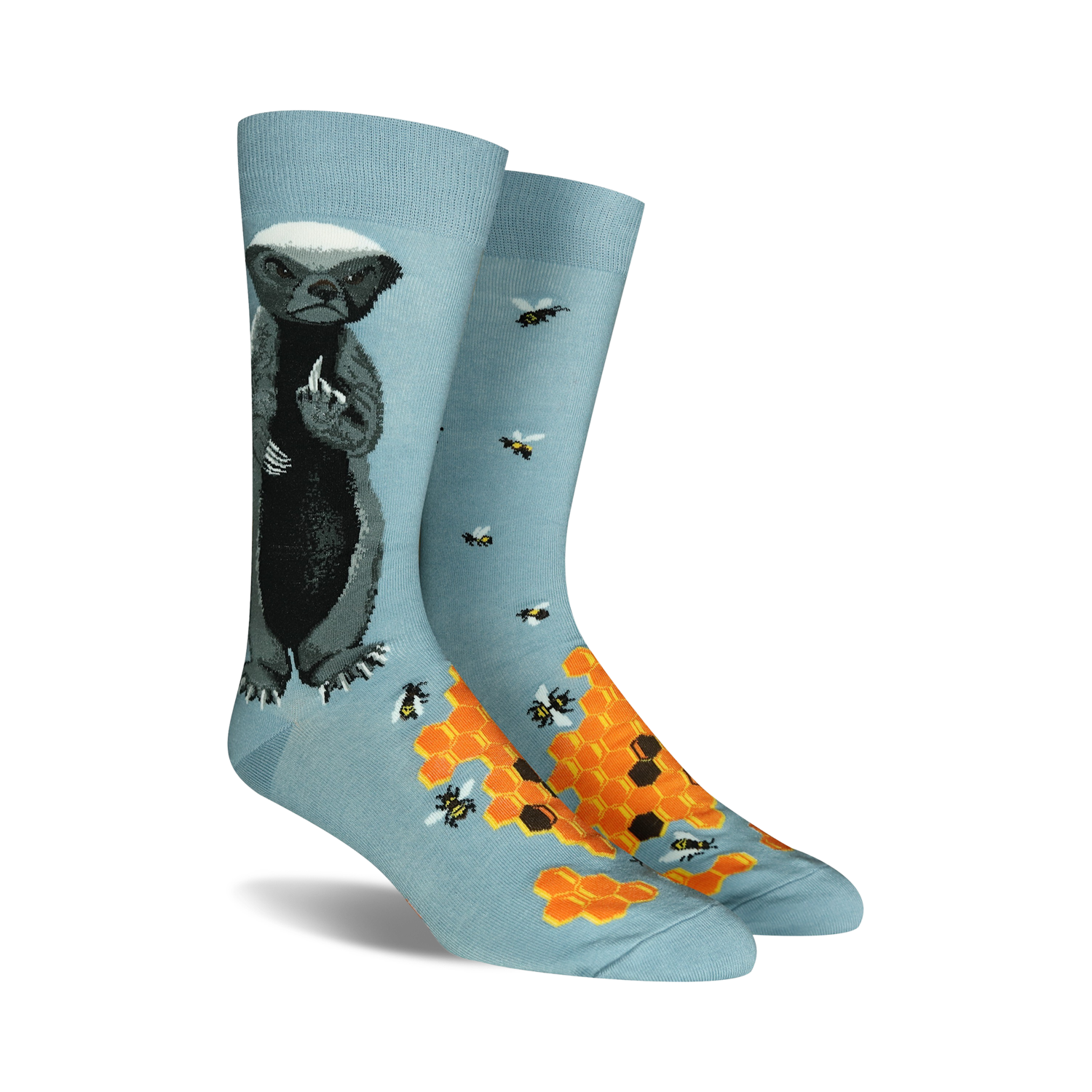 Lifestyle shot of Honey Badger socks being worn outdoors.  Shows the socks on a person's feet in a natural setting.