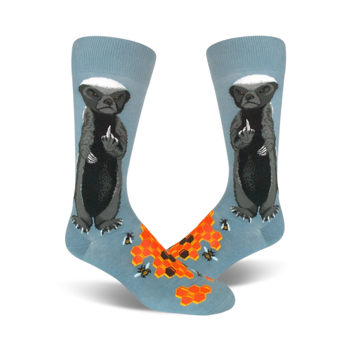 Pair of crew socks; light blue with a honey badger giving the middle finger, honeycomb, and bees illustrated.