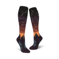 Lifestyle shot: A person's feet wearing the orange and purple Constellations socks with the design visible.