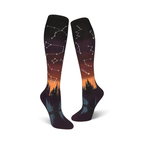 Lifestyle shot: A person's feet wearing the orange and purple Constellations socks with the design visible.