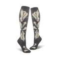 Pair of women's knee-high socks in dark grey with a pastel geometric crystal pattern.  The crystals are iridescent, creating a shimmering effect.