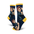 Crew socks in navy and yellow, featuring a graphic of Rosie the Riveter giving the middle finger, with 'Nasty' tattooed on her arm.