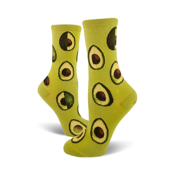 light green avocado phase socks in crew length for women feature a dark green avocado with brown pit pattern.   