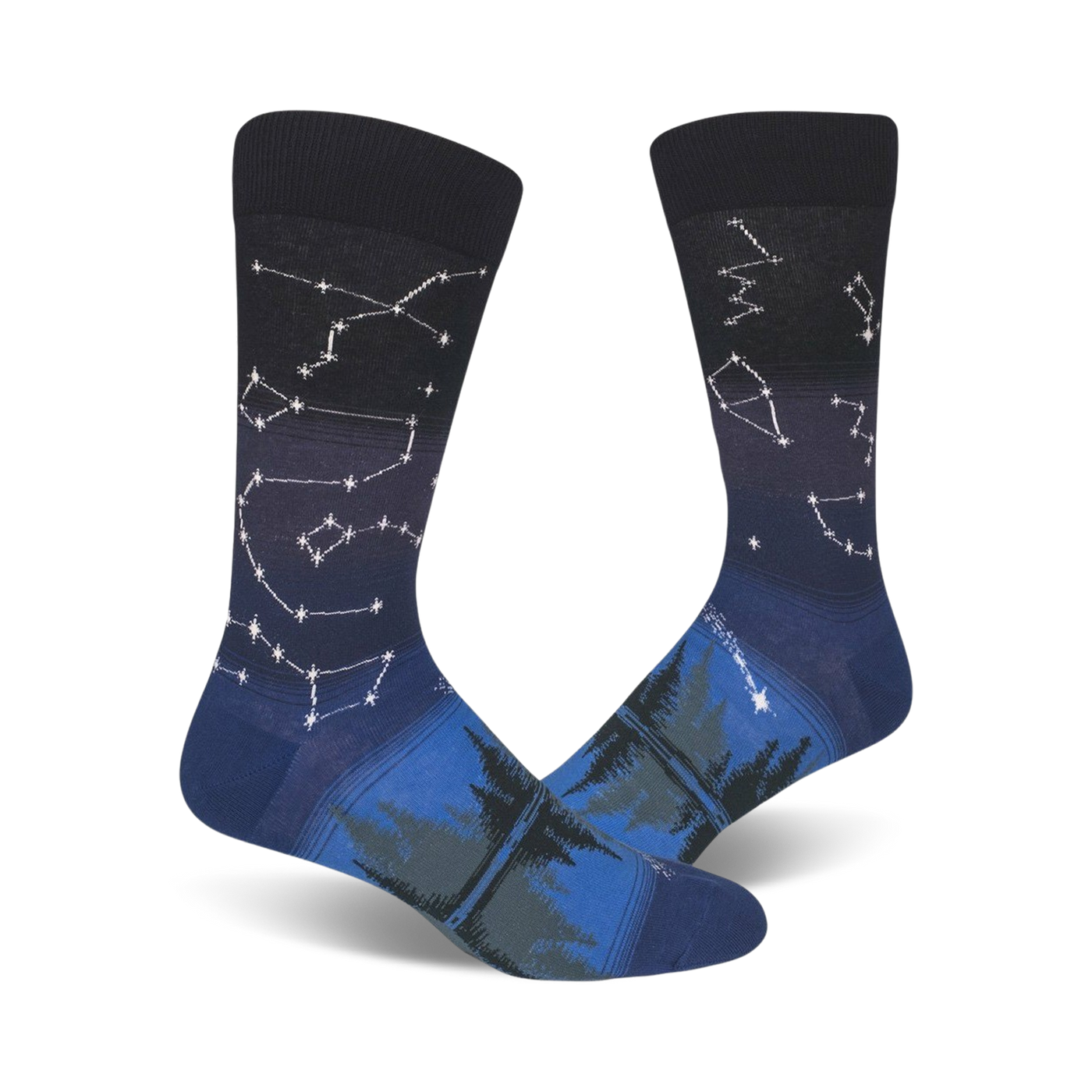 Pair of crew socks in navy blue and dark teal.  Constellation design fades into a forest scene at the bottom.