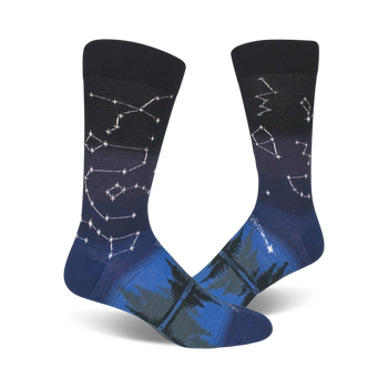 men's crew socks featuring a dark blue background and a pattern of white and light blue constellations and evergreen trees.   