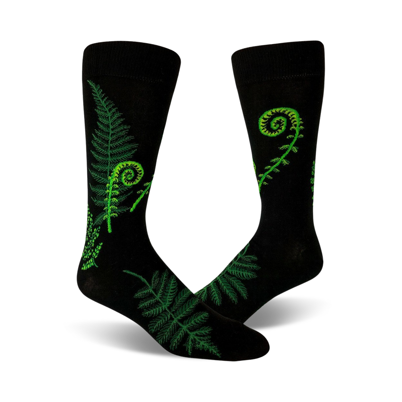 A pair of black crew socks featuring bright green fern and fiddlehead designs. Botanical illustration on a comfortable, everyday sock.