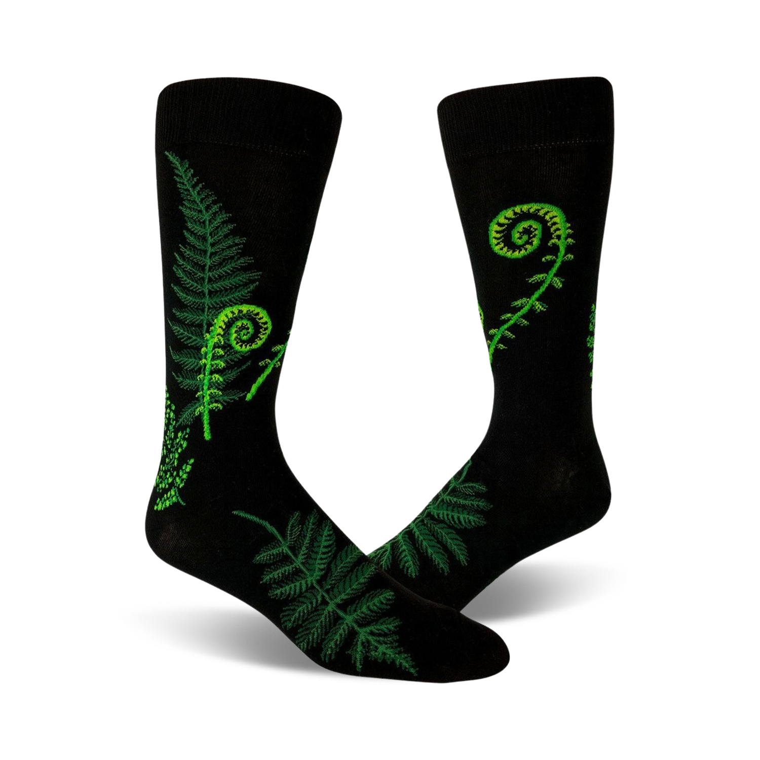 A pair of black crew socks featuring bright green fern and fiddlehead designs. Botanical illustration on a comfortable, everyday sock.