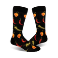 Pair of black crew socks with a fun pattern of red, orange, and green chili peppers of varying types.