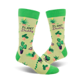A pair of light green crew socks with a pattern of various potted plants and the words 'Plant Daddy' on a pale yellow background.