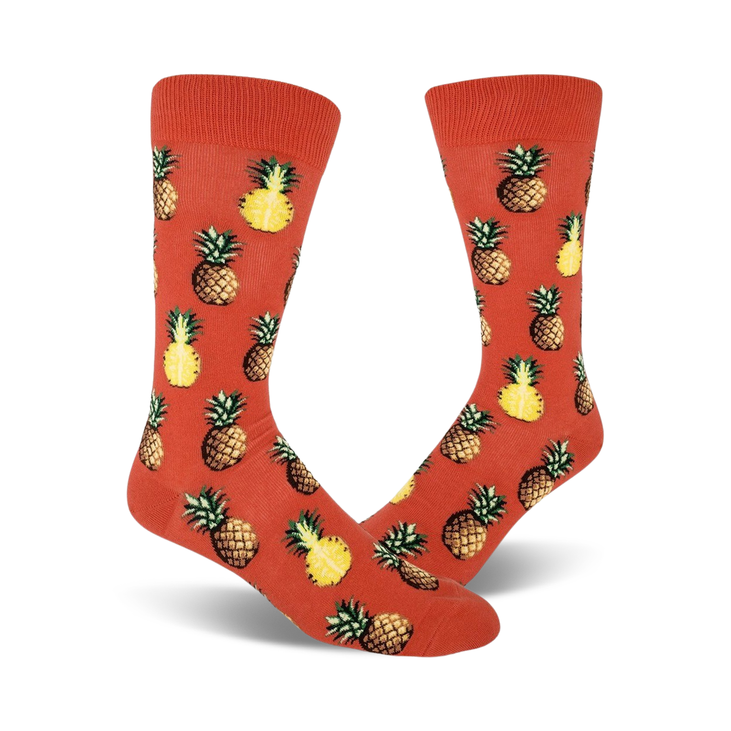Pair of crew socks with orange background and repeated pineapple pattern. Pineapples are yellow and brown.