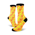 Pair of crew socks with a citrus fruit pattern.  Oranges and lemons in yellow, orange, and pale green on a white background. Black cuffs.
